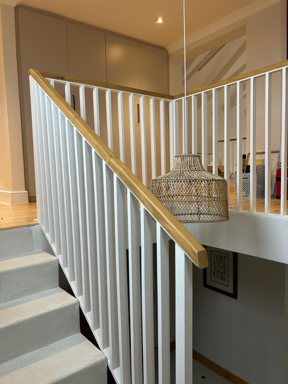 Staircase A beautiful wooden staircase in white and oak tones.