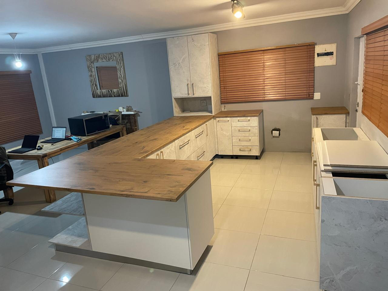 Open plan kitchen Drawers, cupboards and scullery area.